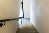 narrow-staircase-with-handrail